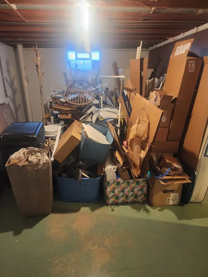 Roll-off dumpster container at job site for 4 Yard Dumpster Rental in Cedar Grove